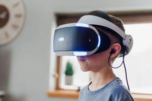 a boy wearing VR goggles